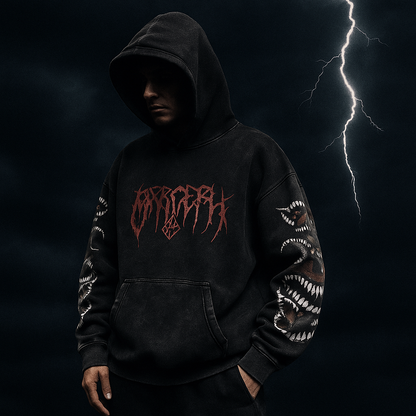 Person wearing a black hoodie with red text against a dark background with lightning.